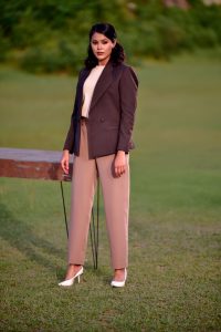How to Choose Outfits You Can Wear on Different Occasions Stylish woman in a suit poses outdoors in Bangladesh, exuding confidence and elegance.